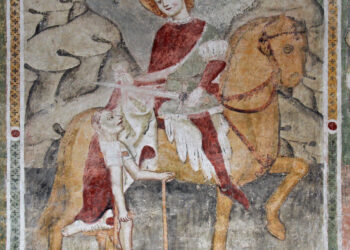 San Martino a cavallo dona il suo mantello ad un mendicante.